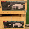 Two stacked plywood crates with KJ K4525 45x25 ft double garage steel barn shed labels