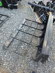 47-inch land leveler grid bed close-up showing crossbar rails and quick-attach plate
