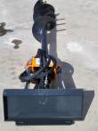 Mini skid steer auger from above: flighted bit, orange drive gearbox and steel quick-attach mount plate