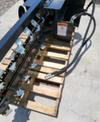 Wolverine trencher chain and teeth, hydraulic hose ends disconnected on pallet