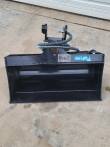 Black Future 3T hydraulic tilt bucket head-on, wide smooth cutting edge and tilt head with hoses