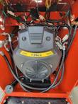 AGT LRT23 mini skid steer engine bay: 739cc twin-cylinder gas engine with cooling fan and wiring harness