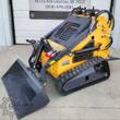 ZJG-380 mini skid steer on rubber tracks with twin control levers, auxiliary hydraulic hoses and bucket tilted forward