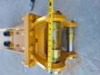 Tape measure across the breaker's mounting bracket pin and bronze bushings, reading about 12 inches