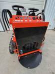 AGT LRT23 mini skid steer control panel: twin joysticks, gauges and key switch above the rear engine grille