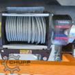Arteer winch drum spooled with steel cable, roller fairlead and clutch lever under the 15,000 lb capacity decal