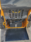 ATS-T460 mini skid steer from the rear: vented engine cover, cooling fan, hydraulic tank sight gauge, stand-on platform