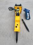 TOFT530 yellow breaker upright with moil point fitted, sleeved hoses, spare chisel and open wrench box