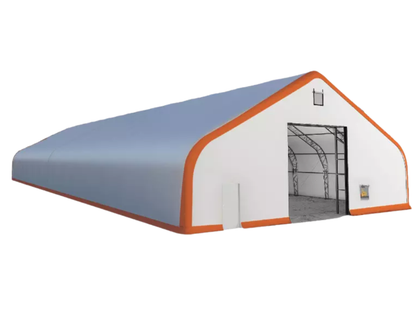 White dual-truss fabric building, orange trim, roll-up door open showing steel frame