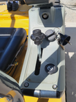 MX12RX mini excavator side console: throttle lever, keyed ignition with the keys in it, and a push-button switch