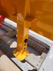 Base of the post driver: square shaft with pin holes, a hex bolt and the domed driver head