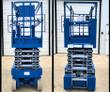 Genie GS-3232 scissor lift from the front and rear, platform lowered, entry gate, scissor stack and drive motors