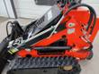 AGT LRT23 mini skid steer hydraulic hose routing and cylinder near the quick-attach mount, AGT decal visible