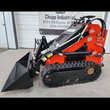 AGT LRT23 mini skid steer, red body with black bucket, rubber tracks and hydraulic lines along the loader arm
