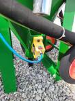 Yellow air/water valve box mounted on the DB500 cart frame near a wheel