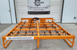Orange Landhonor hay accumulator grapple, rows of curved black bale hooks across an 88-inch steel frame