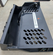 Wolverine rock rake bucket from above: perforated floor and mesh sidewall, hydraulic hoses and motor