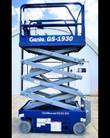 Genie GS-1930 scissor lift in blue with the scissor stack partly extended and the platform raised above the base