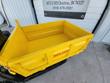 Yellow steel dump bed of the mini dumper from above, removable side panels and rubber track