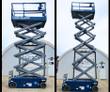 Genie GS-3232 scissor lift raised to full height on its extended scissor stack, platform guardrails up