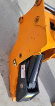 Orange Wolverine jaw arm with pin bores, black cylinder and a red crush-hazard danger label