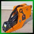 Orange Wolverine hydraulic clamp with cylinder, hoses and mounting pins, green border graphic