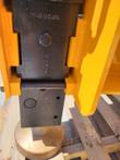 Post driver lower housing and shaft: cross pin, mounting holes and the domed driver head at the base