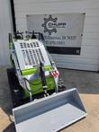 ATS T460 mini skid steer rear grille and red hydraulic quick couplers, bucket visible at front
