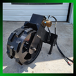 Black steel compaction wheel with lug pads, mounted on a quick-attach frame with hydraulic motor