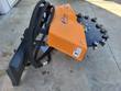 Arteer stump grinder, side view: quick-attach plate, hoses, orange shield with danger decal, toothed cutting wheel