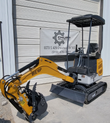 IRE18P mini excavator with boom extended, toothed bucket and thumb, dozer blade and rubber tracks