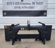 Wolverine 3-point hitch adapter, front view: skid steer plate, A-frame mast, lock levers and lower hitch arms