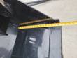 Tape measure across the IRanch bucket's cutting edge, reading about 20 inches