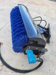 Angle broom with blue poly bristle roller, black hood, blue hydraulic drive motor and mount bracket