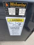 Wolverine data plate: model TDB-11-84W, 580 lbs, 86 in wide, 2025, above a fall and crush warning