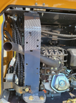 IRE18P engine compartment with caged muffler, exhaust pipe and hydraulic hose routing
