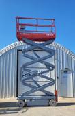 Skyjack SJIII 3226 scissor lift raised, scissor stack extended outdoors