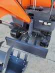 ATS-ME18 mini excavator's rubber tracks and dozer blade, with the bucket and grapple thumb alongside