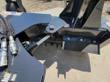 Drive end of the power rake: hydraulic motor, quick couplers and the drum angle pivot
