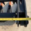 Quick-attach mount and hinge of the grapple bucket, tape measure spanning about 76 inches across the frame