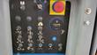 Genie ground control panel: function toggle switches, red emergency stop, key switch and hour meter reading 1183