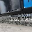 Drum mulcher front chain guard: rows of steel chain hanging from the deflector to block flying debris