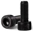 Two black oxide socket head cap screws, one showing the hex socket and 12.9 grade stamp on the head