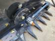 Sickle mower drive end: eccentric pulley and pitman arm driving the reciprocating knife behind the pointed guards