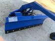 Blue 6-way dozer blade, angled view with caution decals, hydraulic hoses, and rubber-edged cutting edge