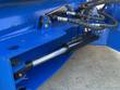 Wireless remote control pendant with directional buttons, wired to the blade's hydraulic valve block