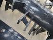 Welded steel tines in staggered rows along the black rock rake drum