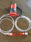12V oil transfer pump with battery clamps, two clear hoses and quick-connect tank drain fittings