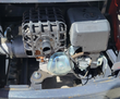 MX15R mini excavator engine bay with OHV engine, carburetor, air filter and caged muffler