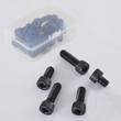 Five black socket head cap screws beside a clear plastic storage box holding more screws
